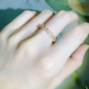 Close-up of double-row gold plated eternity ring with micro-pave cubic zirconia crystals