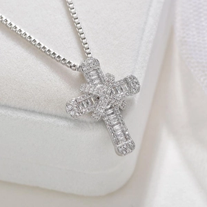 Silver iced out double cross pendant necklace with zircon stones in a jewelry box