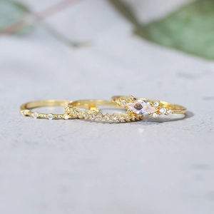 Three-piece gold plated ring set with marquise cut zircon stones and pavé bands
