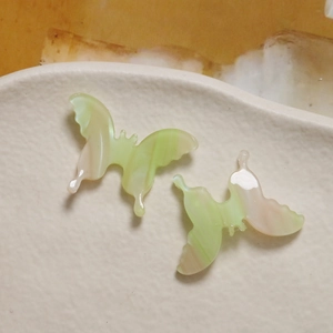 Detailed macro of gradient marble texture on 3D acetate butterfly DIY charms