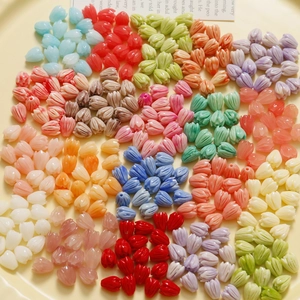 Detailed view of colorful tulip bud beads with pleated texture for DIY jewelry making