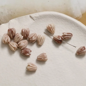 Macro detail of tulip shell beads with natural textures for DIY jewelry crafting