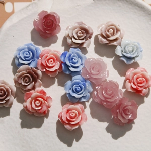 Detailed close-up of 16mm gradient shell powder rose beads for DIY jewelry and crafts