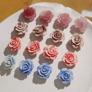 Macro detail of 16mm shell powder gradient rose flower beads for DIY jewelry and crafts