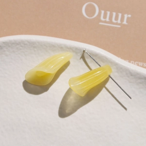 Detailed view of yellow translucent resin flower petals with fine textured vertical stripes