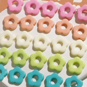 Colorful resin flower beads for DIY jewelry making in pink, white, green, and blue