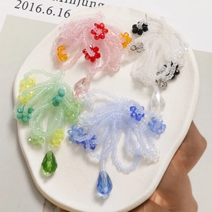 Handmade beaded flower charms with crystals in pink, green and blue for DIY hair accessories