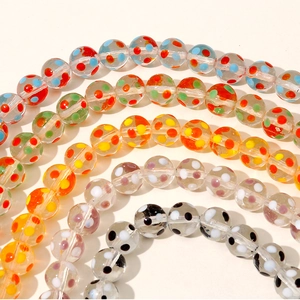 Macro detail of rainbow polka dot glass beads for DIY jewelry and hair accessory making