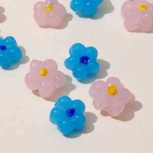 Pink and blue resin flower beads with yellow centers for DIY jewelry making