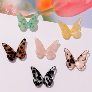 Colorful butterfly acetate earring charms in leopard print and floral patterns