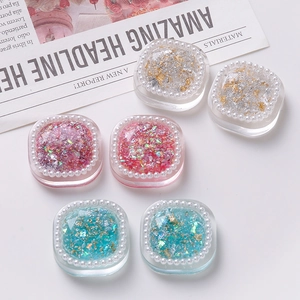 Handmade transparent resin charms with pearls, gold foil and colorful glitter accents