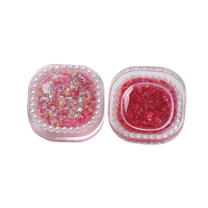Pink holographic sequins and fine glitter set in elegant pearl-edged transparent boxes