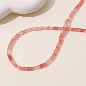 Close-up of translucent pink rectangle resin beads with marble texture for jewelry DIY