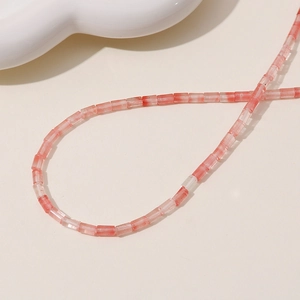 Detailed macro shot of long pink strawberry quartz cylinder beads for jewelry making