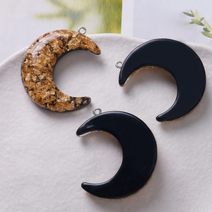 Golden foil C-shaped moon pendants and black resin charms for DIY jewelry making