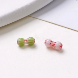 Macro view of 8mm peanut shaped glass beads with colorful stripes for DIY jewelry making