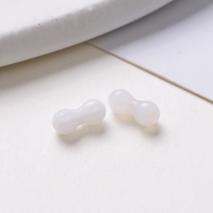Macro view of 8mm oval translucent white glass beads for DIY jewelry and earring making