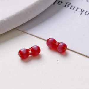 Macro shot of 8mm red translucent glass beads for DIY jewelry and bracelet crafts