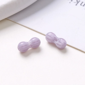 Macro shot of 8mm light purple peanut shaped glass beads for DIY jewelry making