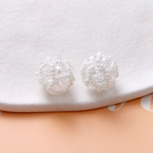 Macro view of handmade woven pearl beads and crystal spheres for DIY jewelry making