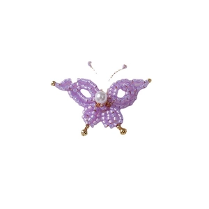 Handmade purple beaded butterfly pendant with white pearl and gold accents on white background