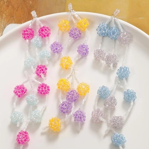Macro shot of colorful beaded berry cluster accessories for DIY jewelry making