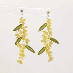 Handmade long green leaf floral tassel earrings with yellow flowers and golden wire