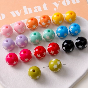 Close-up of 16mm colorful resin beads with white star patterns for DIY jewelry making