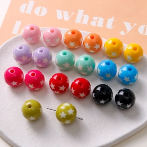 Macro shot of colorful 16mm acrylic star beads on metal pins for DIY jewelry making