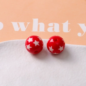 Detailed macro view of 16mm red resin star beads with precise round holes for DIY jewelry