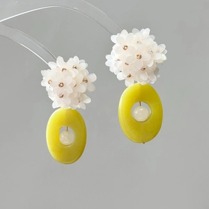 Handmade floral drop earrings with white frosted flowers and yellow oval resin pendants