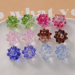 Macro view of colorful sea urchin glass beads with hole for DIY jewelry making