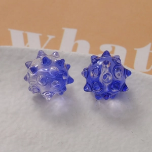 Detailed macro view of dark blue translucent sea urchin beads for DIY jewelry making