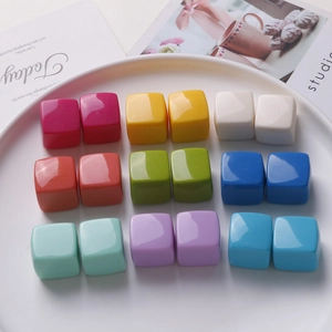 Close-up of colorful 20mm macaron resin cube charms for DIY jewelry making