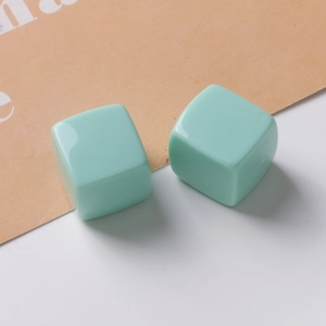 Detail of 20mm mint green resin cube charms with glossy finish for jewelry making