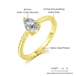 Detail view of 5x7mm AAA+ pear-cut cubic zirconia on a gold-plated twisted rope band