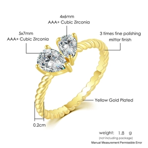 Detail of double pear-cut cubic zirconia ring with gold-plated twisted band finish