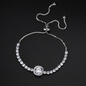 Macro shot of silver-tone bolo bracelet with round main stone and zircon paving