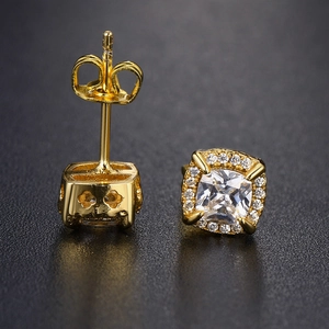 Macro view of gold square halo stud earrings featuring micro-pave cubic zirconia stones