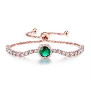 Detailed macro of rose gold adjustable bracelet with round green gem and zircon pavé stones