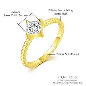 Detail of twisted gold ring band with a 6x6mm AAA+ princess cut cubic zirconia stone