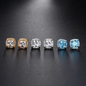 Detailed comparison of halo-set cushion-cut hip-hop studs in gold and silver finishes