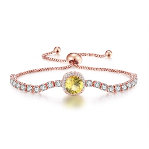 Close-up of adjustable rose gold bracelet with yellow gemstone and white zircon stones