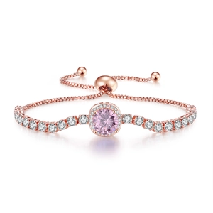 Detail of rose gold adjustable bracelet with round pink gemstone and white zircon stones