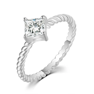 Detail of princess cut zircon ring featuring a silver twist band and four-prong setting