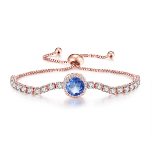 Macro detail of adjustable rose gold bracelet with blue cubic zirconia and micro-pavé stones
