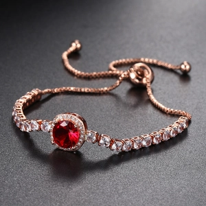 Adjustable rose gold tennis bracelet with large red round zircon stone and halo detail
