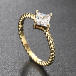 Gold braided twisted ring for women featuring a square-cut sparkling zircon center stone