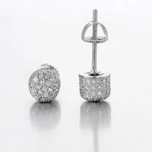 Macro shot of silver hip hop screw-back earrings with pavé set zircon stones