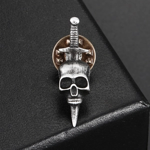 Vintage silver gothic skull and dagger brooch in punk style for leather biker jackets